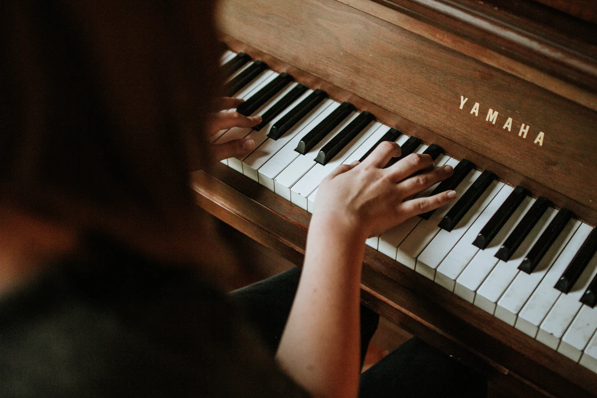 Chord Progression to MIDI Hands playing chords on a piano